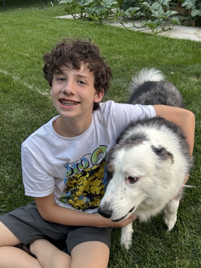 Eli with a neighborhood dog